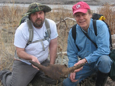 Andrew Fallak and Bob Wrigley showing a partial Bison skull