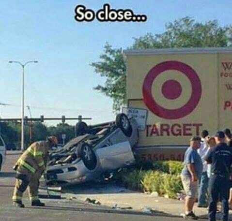 Photo of crashed car next to Target Store Sign.